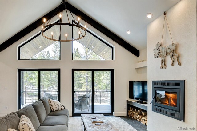 30298 San Isabel Rd, Buena Vista, CO 81211 - living room featuring a chandelier, beamed ceiling, high vaulted ceiling, baseboards, and tile patterned floors
