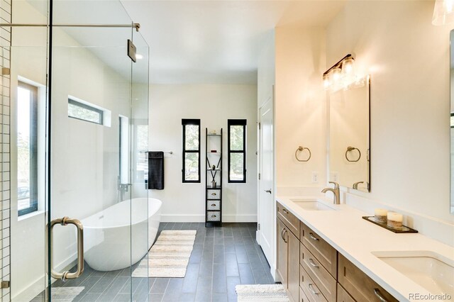 30298 San Isabel Rd, Buena Vista, CO 81211 - bathroom with a freestanding bath, double vanity, baseboards, and a shower with shower door