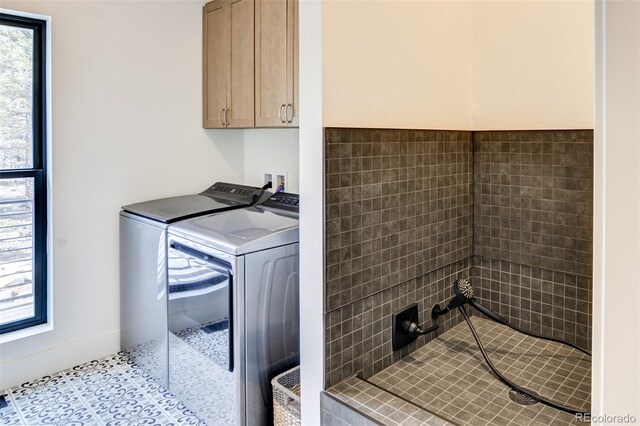 30298 San Isabel Rd, Buena Vista, CO 81211 - washroom with washer and clothes dryer, cabinet space, plenty of natural light, and tile patterned flooring