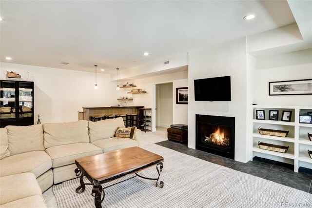 30298 San Isabel Rd, Buena Vista, CO 81211 - living area featuring a lit fireplace and recessed lighting
