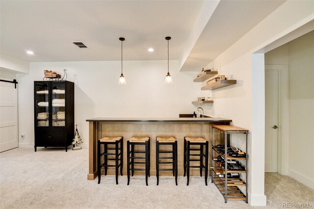 30298 San Isabel Rd, Buena Vista, CO 81211 - indoor wet bar with carpet, a barn door, recessed lighting, pendant lighting, and baseboards