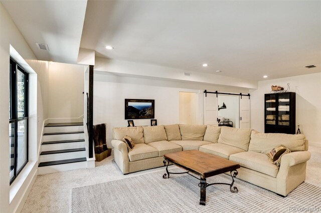 30298 San Isabel Rd, Buena Vista, CO 81211 - living room featuring light colored carpet, a barn door, recessed lighting, and stairway