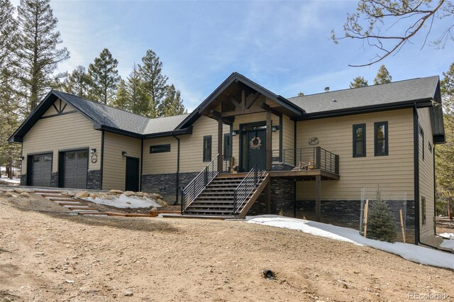 30298 San Isabel Rd, Buena Vista, CO 81211 - view of front facade featuring stone siding and an attached garage