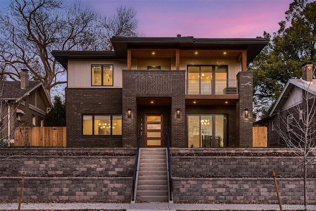 view of front of property with a balcony