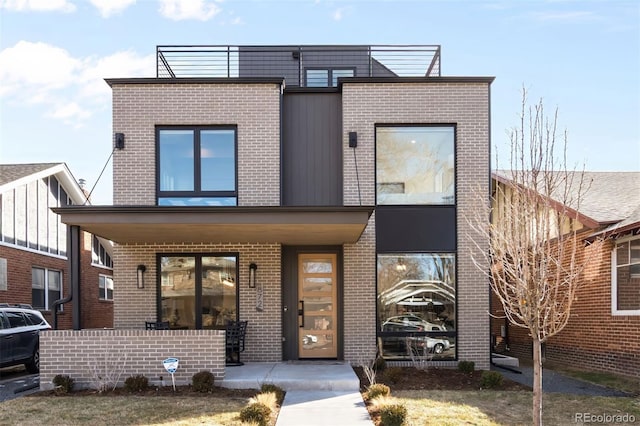 view of front of house featuring brick siding