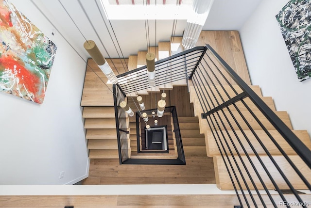 staircase featuring wood finished floors