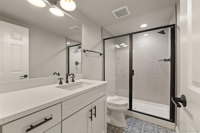 full bath with a stall shower, toilet, vanity, tile patterned flooring, and recessed lighting