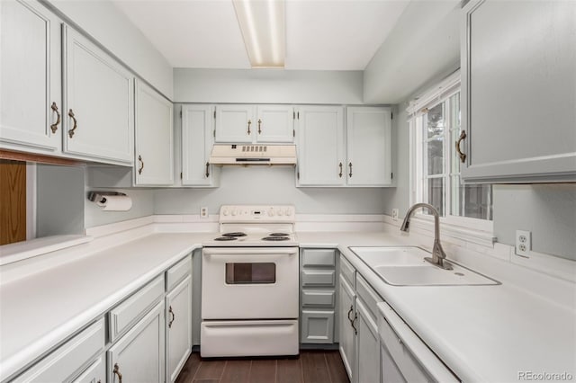 kitchen with white range with electric cooktop, light countertops, white cabinets, a sink, and under cabinet range hood