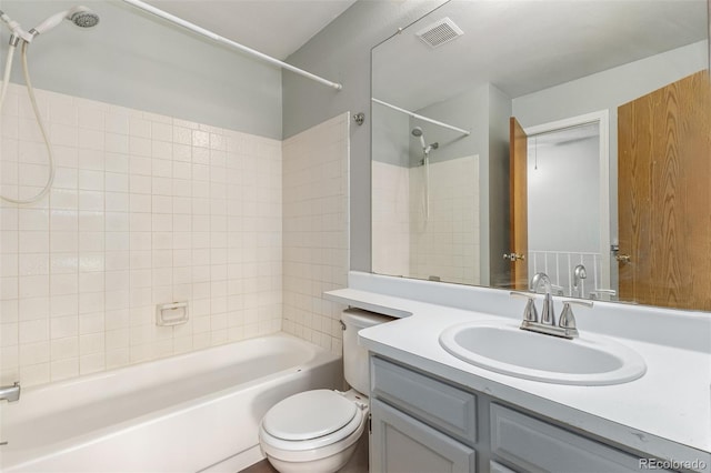 bathroom with visible vents, vanity, toilet, and bathing tub / shower combination