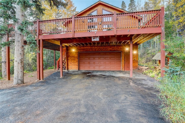 view of front facade with a deck and a garage