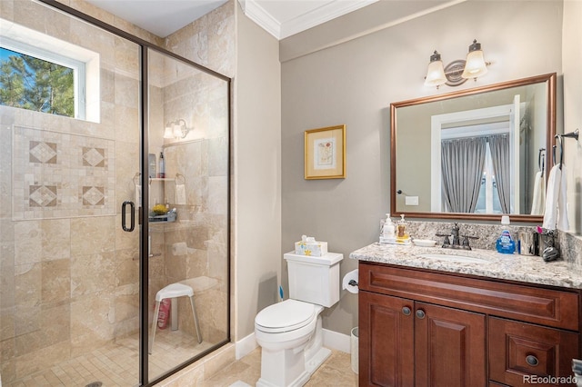 full bathroom featuring a shower stall, vanity, ornamental molding, and toilet
