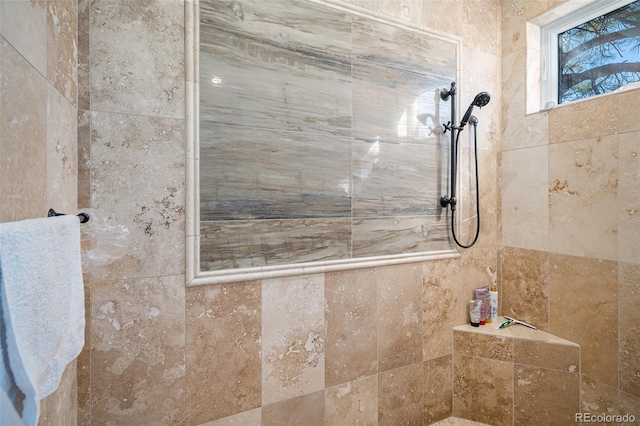 full bath with a tile shower