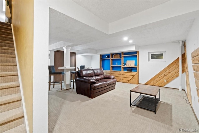 2306 S Troy St Unit A, Aurora, CO 80014 - living room with a textured ceiling, baseboards, carpet floors, and stairs
