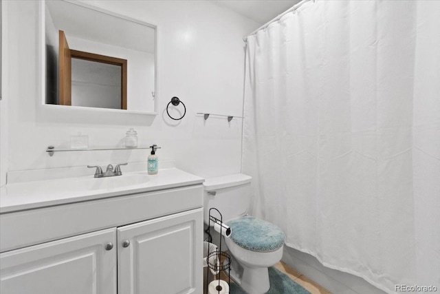 2306 S Troy St Unit A, Aurora, CO 80014 - full bath featuring toilet, vanity, and a shower with shower curtain