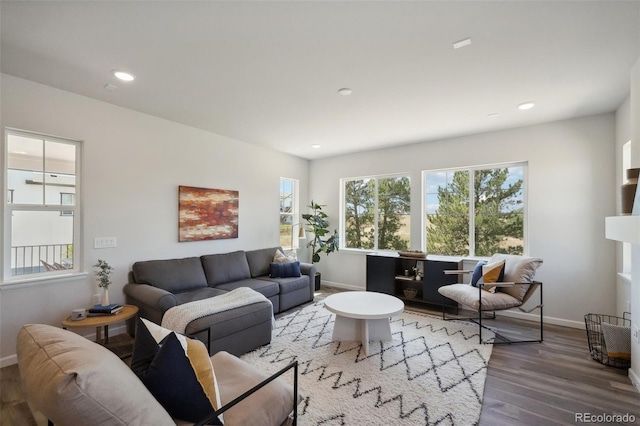 living room with recessed lighting, wood finished floors, and baseboards