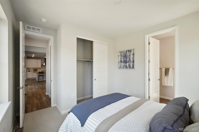 bedroom featuring baseboards, visible vents, a closet, and carpet floors