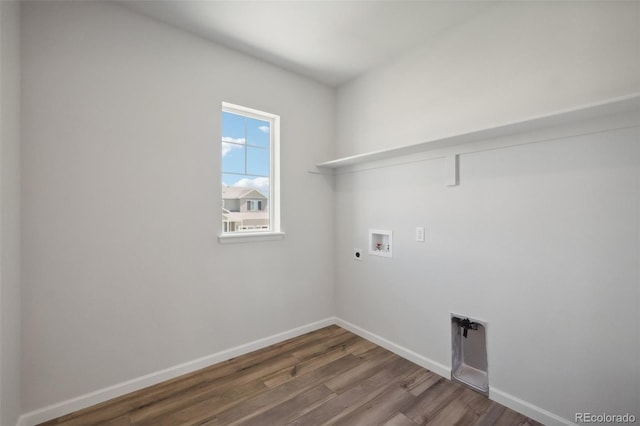 clothes washing area with wood finished floors, baseboards, hookup for an electric dryer, hookup for a washing machine, and laundry area