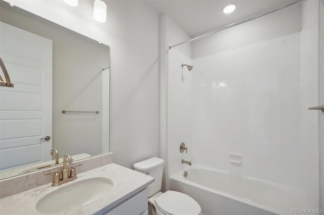 bathroom featuring bathing tub / shower combination, toilet, and vanity