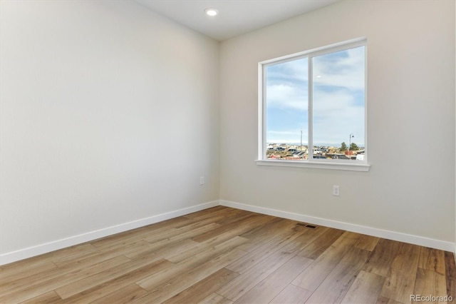 13900 Hanging Lake St, Parker, CO 80138 - spare room with baseboards, visible vents, light wood-style flooring, and recessed lighting