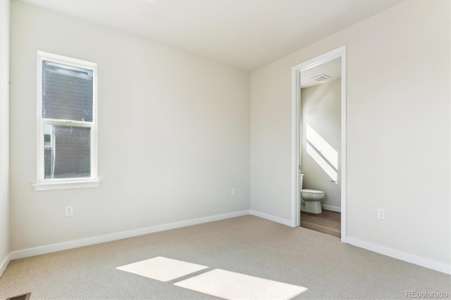 13900 Hanging Lake St, Parker, CO 80138 - unfurnished bedroom with carpet, baseboards, and connected bathroom