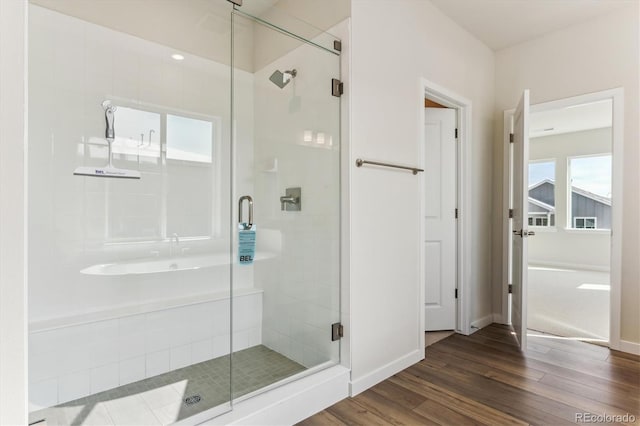13900 Hanging Lake St, Parker, CO 80138 - full bathroom featuring baseboards, wood finished floors, and a shower stall