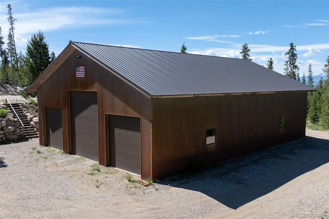 exterior space featuring an outbuilding and a garage