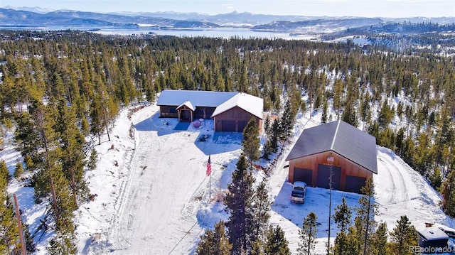 snowy aerial view with a mountain view