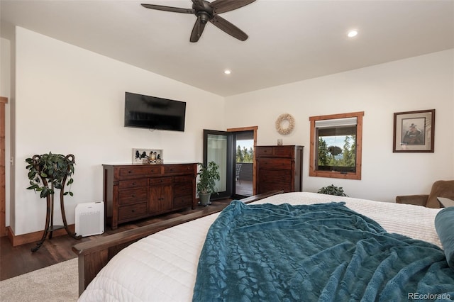 bedroom featuring dark hardwood / wood-style flooring, ceiling fan, and lofted ceiling