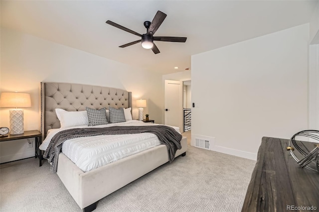 bedroom featuring ceiling fan and light carpet