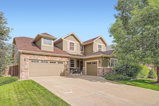 15056 Fillmore Way, Thornton, CO 80602 - craftsman-style house featuring an attached garage, driveway, board and batten siding, and stone siding