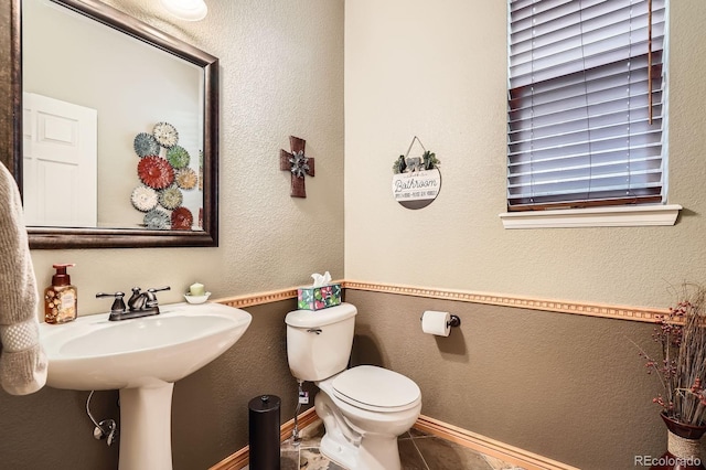 15056 Fillmore Way, Thornton, CO 80602 - half bath with toilet and tile patterned floors