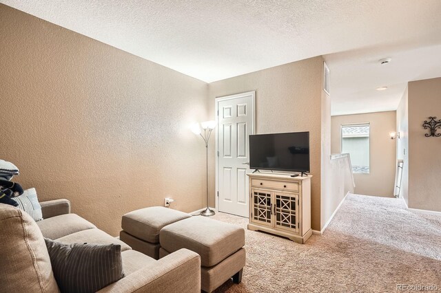15056 Fillmore Way, Thornton, CO 80602 - carpeted living room featuring a textured wall and baseboards