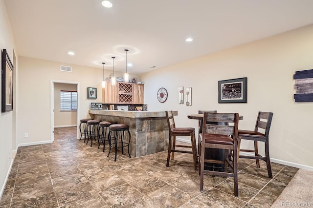 15056 Fillmore Way, Thornton, CO 80602 - indoor dry bar with recessed lighting and hanging light fixtures