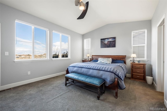 carpeted bedroom with ceiling fan and vaulted ceiling