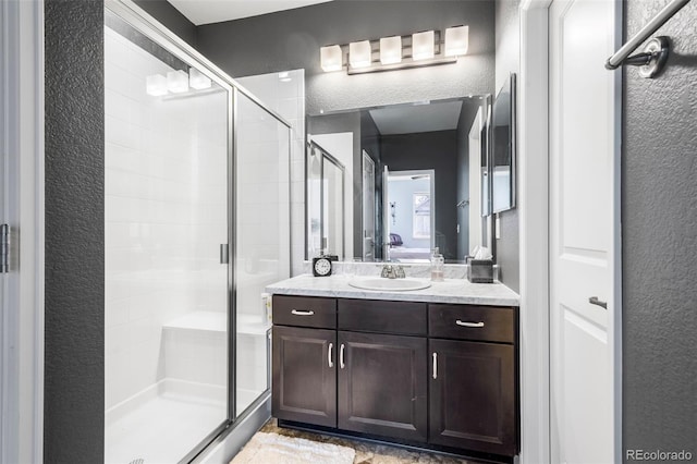 bathroom with vanity and walk in shower