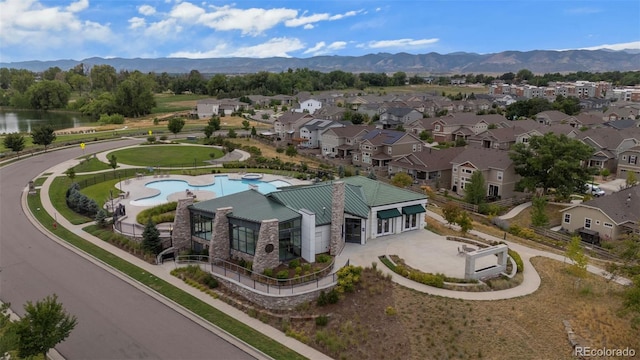 birds eye view of property featuring a water and mountain view