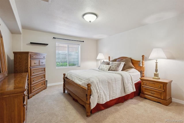 3305 White Oak Ln, Highlands Ranch, CO 80129 - bedroom featuring light carpet and a textured ceiling