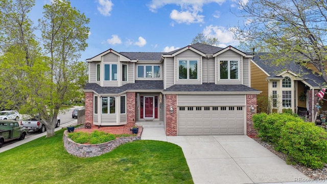 5282 Devon Ave, Castle Rock, CO 80104 - view of front of house with brick siding, concrete driveway, a garage, and a front lawn
