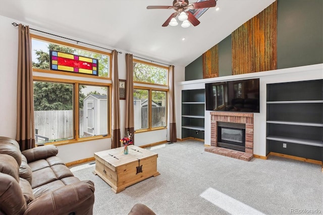 5282 Devon Ave, Castle Rock, CO 80104 - living room featuring a ceiling fan, vaulted ceiling, carpet flooring, baseboards, and a fireplace