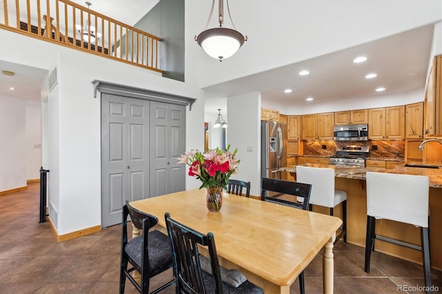 5282 Devon Ave, Castle Rock, CO 80104 - dining room featuring recessed lighting, a high ceiling, and baseboards