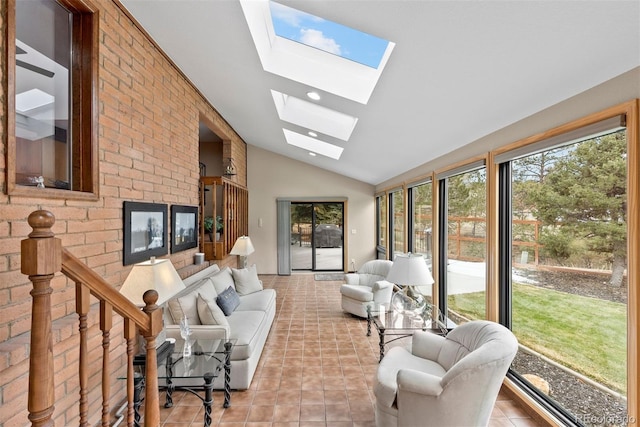 sunroom / solarium featuring vaulted ceiling with skylight