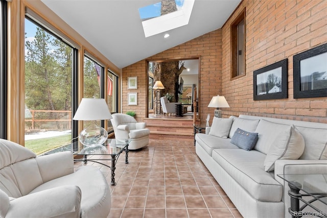 sunroom / solarium featuring lofted ceiling with skylight