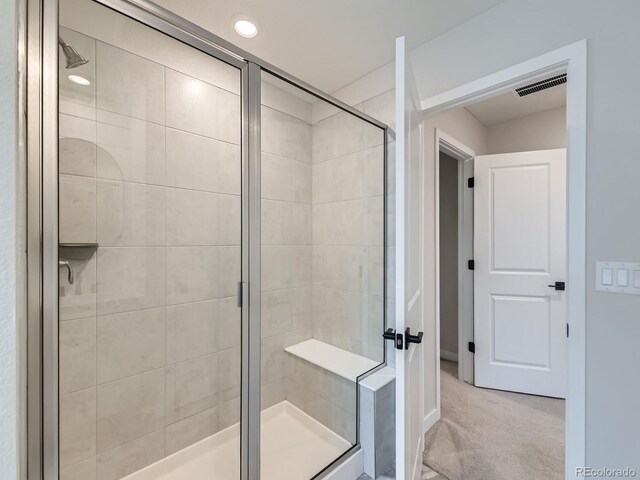 full bathroom with a shower stall and recessed lighting