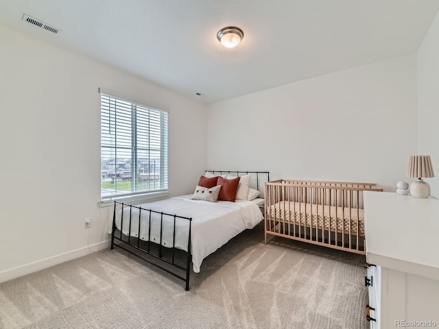 bedroom with carpet floors and baseboards