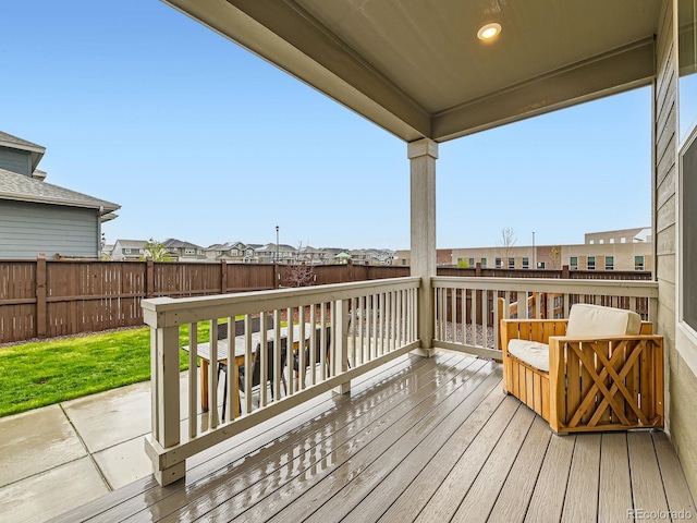 deck with a fenced backyard and a residential view