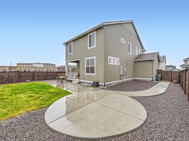 back of property featuring a patio area