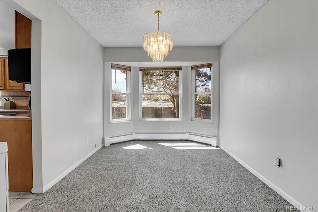 unfurnished dining area featuring a baseboard radiator, a chandelier, light colored carpet, a textured ceiling, and baseboards