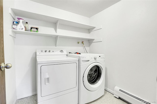 laundry room featuring a baseboard radiator, baseboards, and washer and clothes dryer