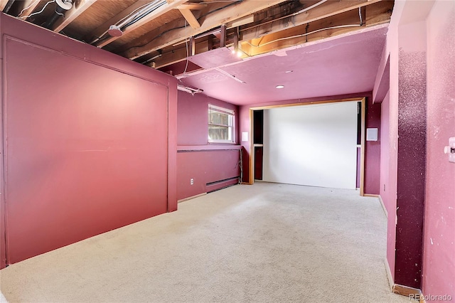 carpeted home theater room with baseboard heating