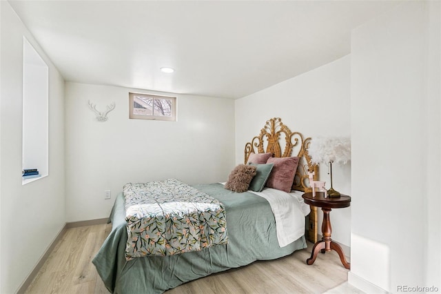 bedroom with wood-type flooring